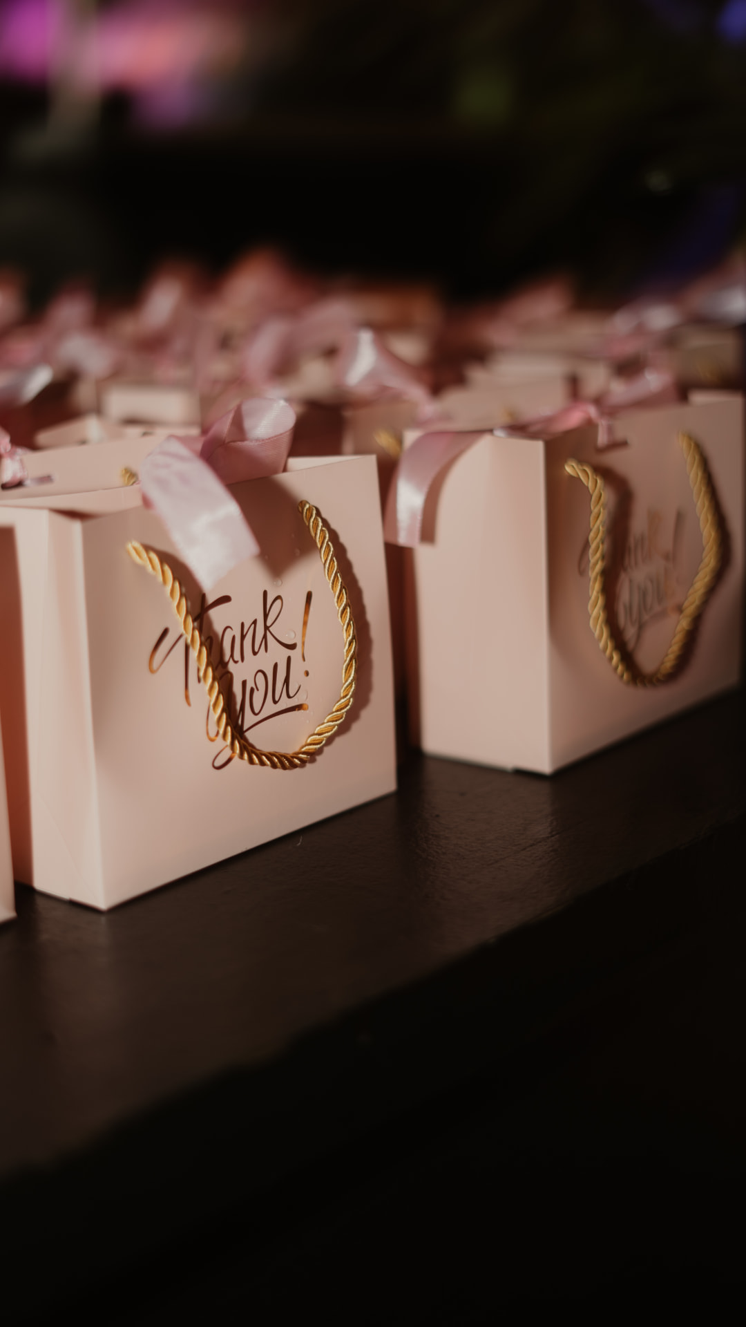 Rows of pink thank you gift bags from Pink Friday
